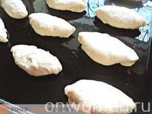 Patties with cabbage on yeast dough in the oven